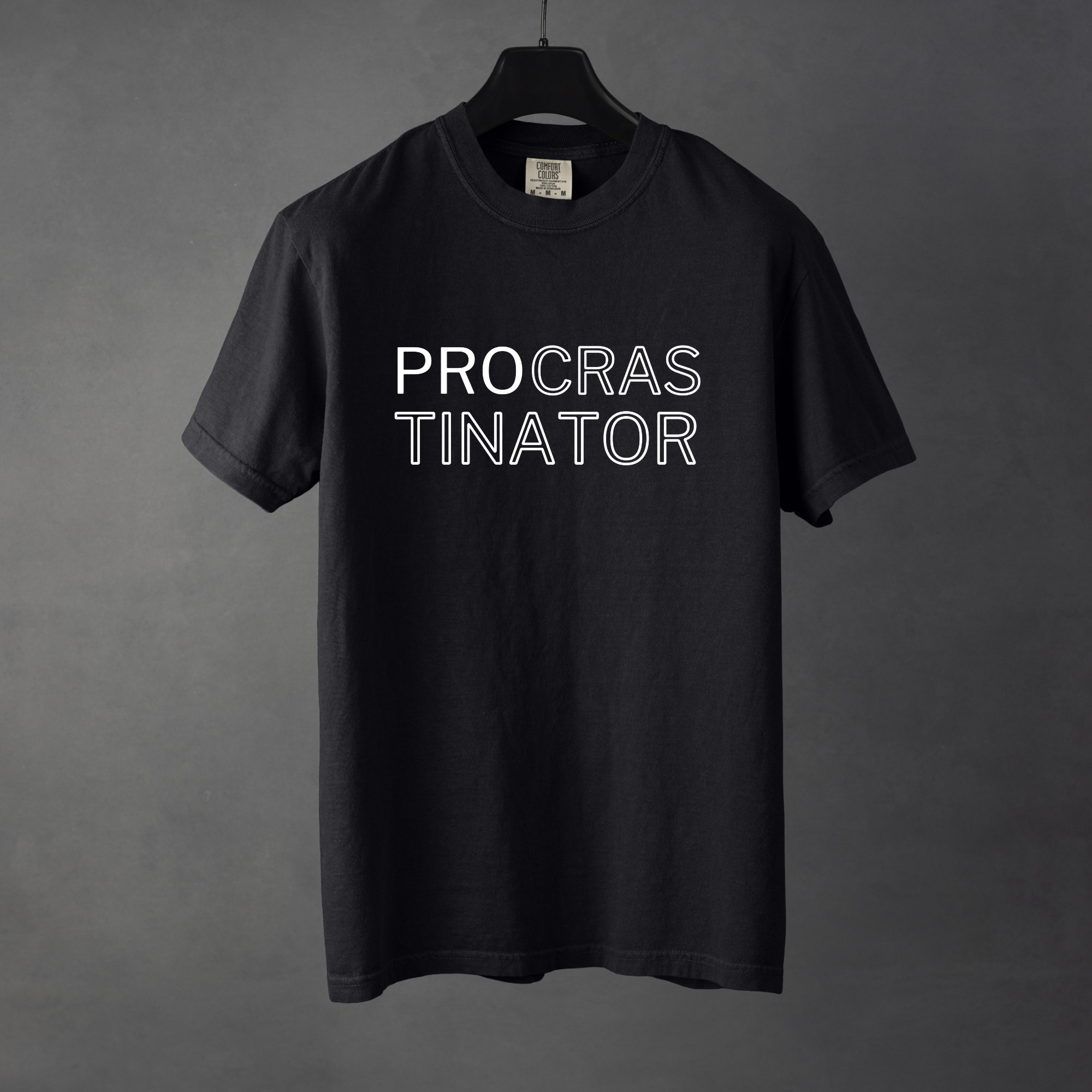 Sarcastic funny black graphic t-shirt with bold text saying 'Procrastinator'