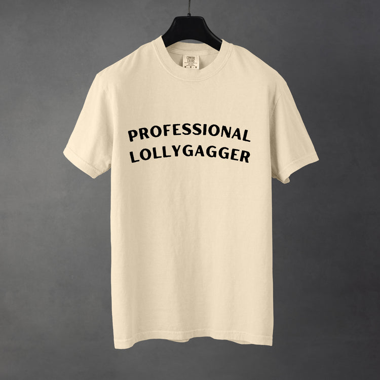 Sarcastic funny ivory graphic t-shirt with bold text saying'professional lollygagger'