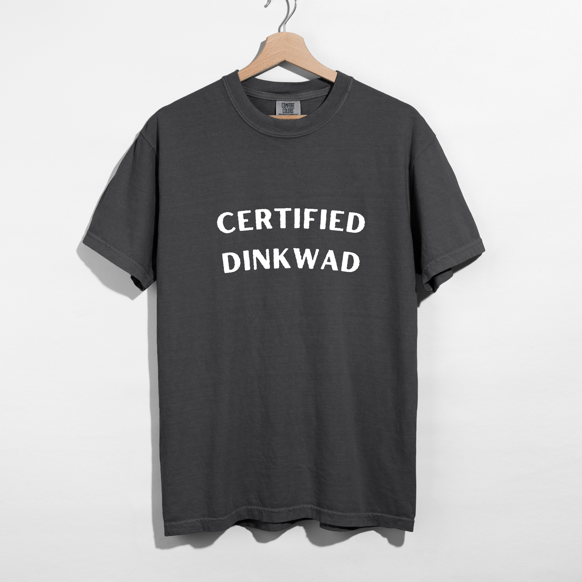 Sarcastic funny pepper graphic t-shirt with bold text saying'Certified Dinkwad'