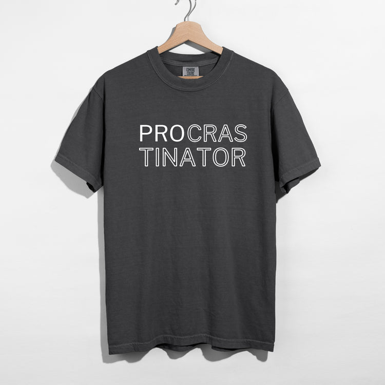 Sarcastic funny pepper graphic t-shirt with bold text saying 'procrastinator'