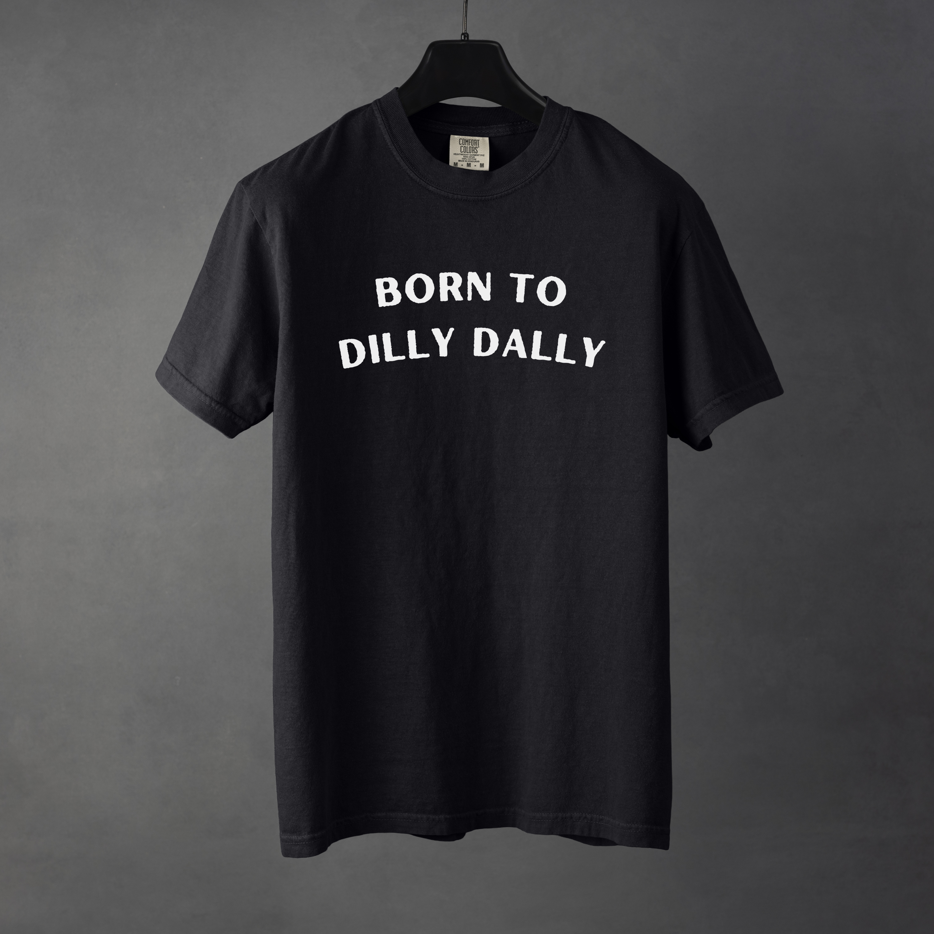 Sarcastic funny black graphic t-shirt with bold text saying 'Born to Dilly Dally'