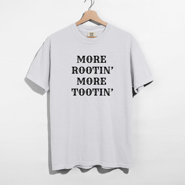 Sarcastic funny white graphic t-shirt with bold text saying more rootin' more tootin'