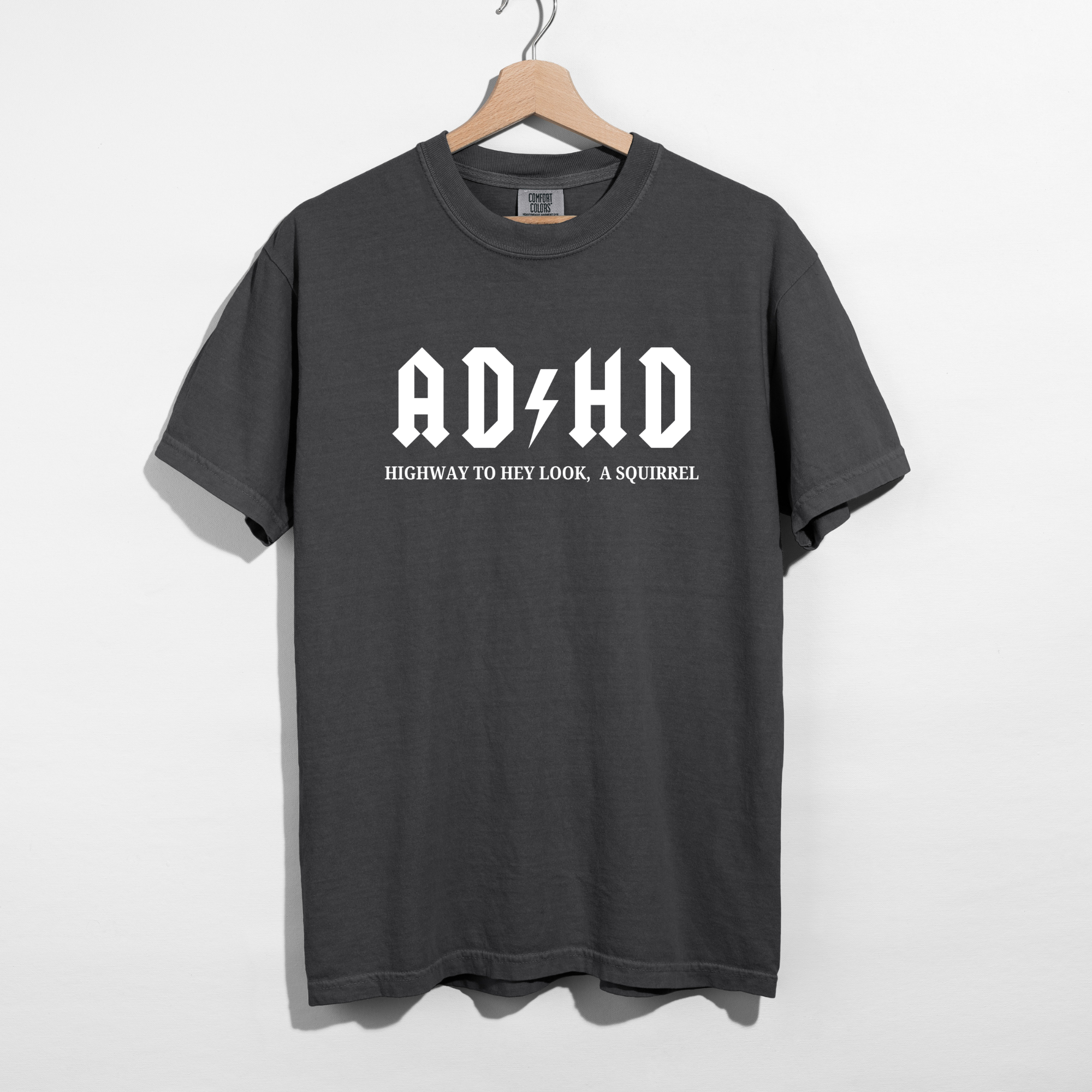 Sarcastic funny pepper graphic t-shirt with bold text saying 'ADHD highway to hey look a squirrel'