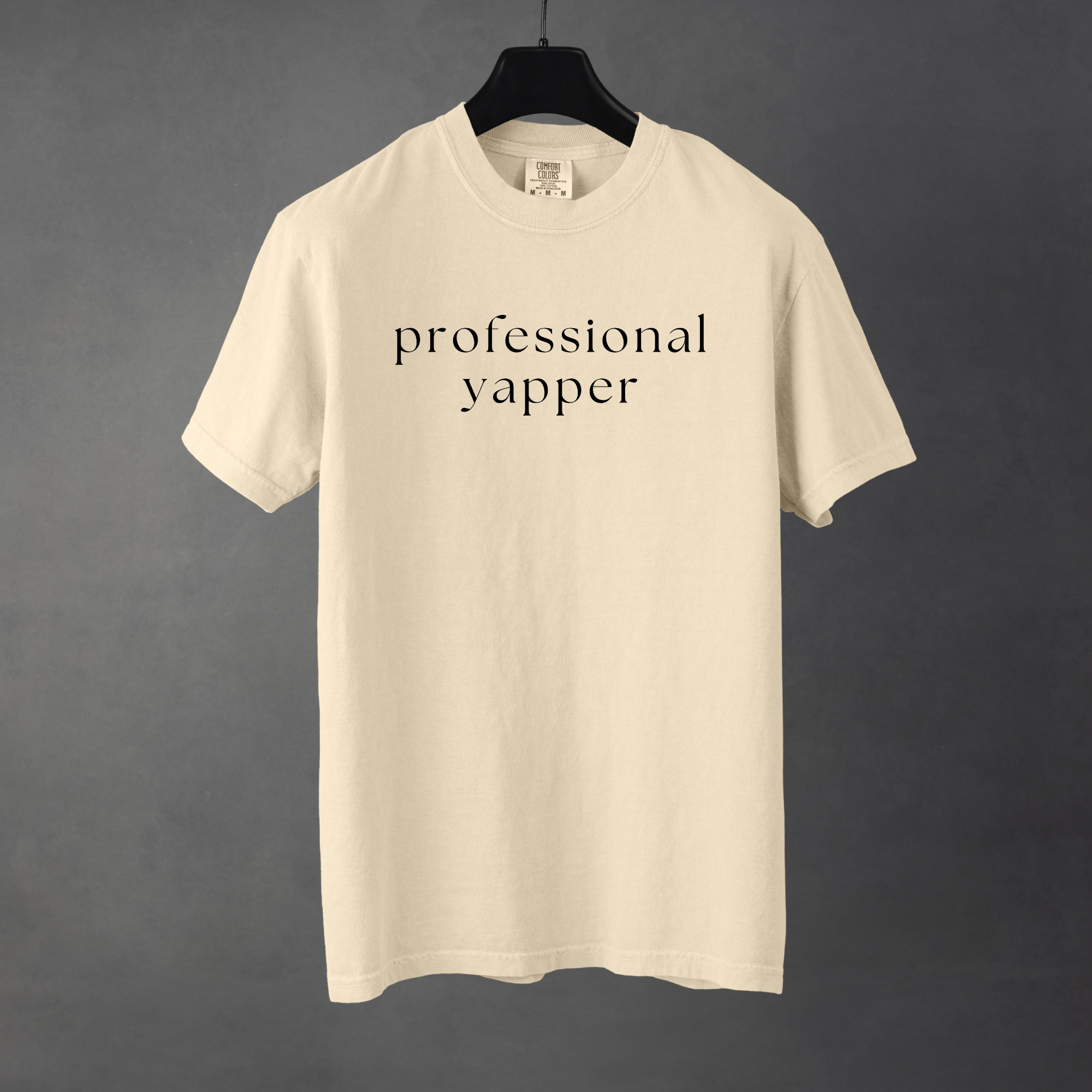 Sarcastic funny ivory cream graphic t-shirt with bold text saying 'professional yapper'