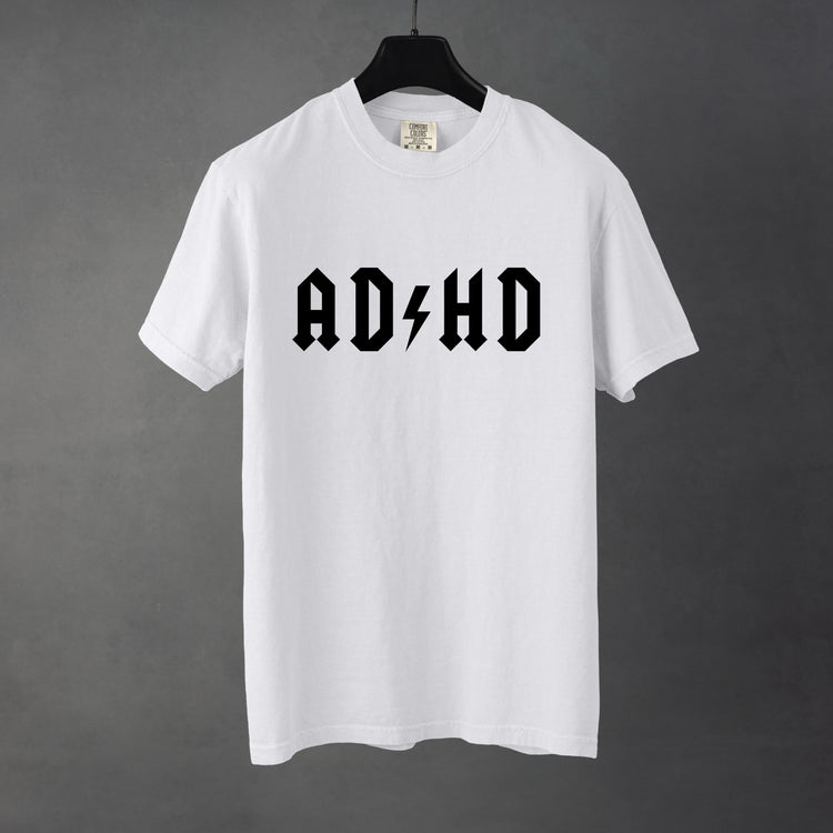 Sarcastic funnyWhite graphic t-shirt with bold text saying 'ADHD'